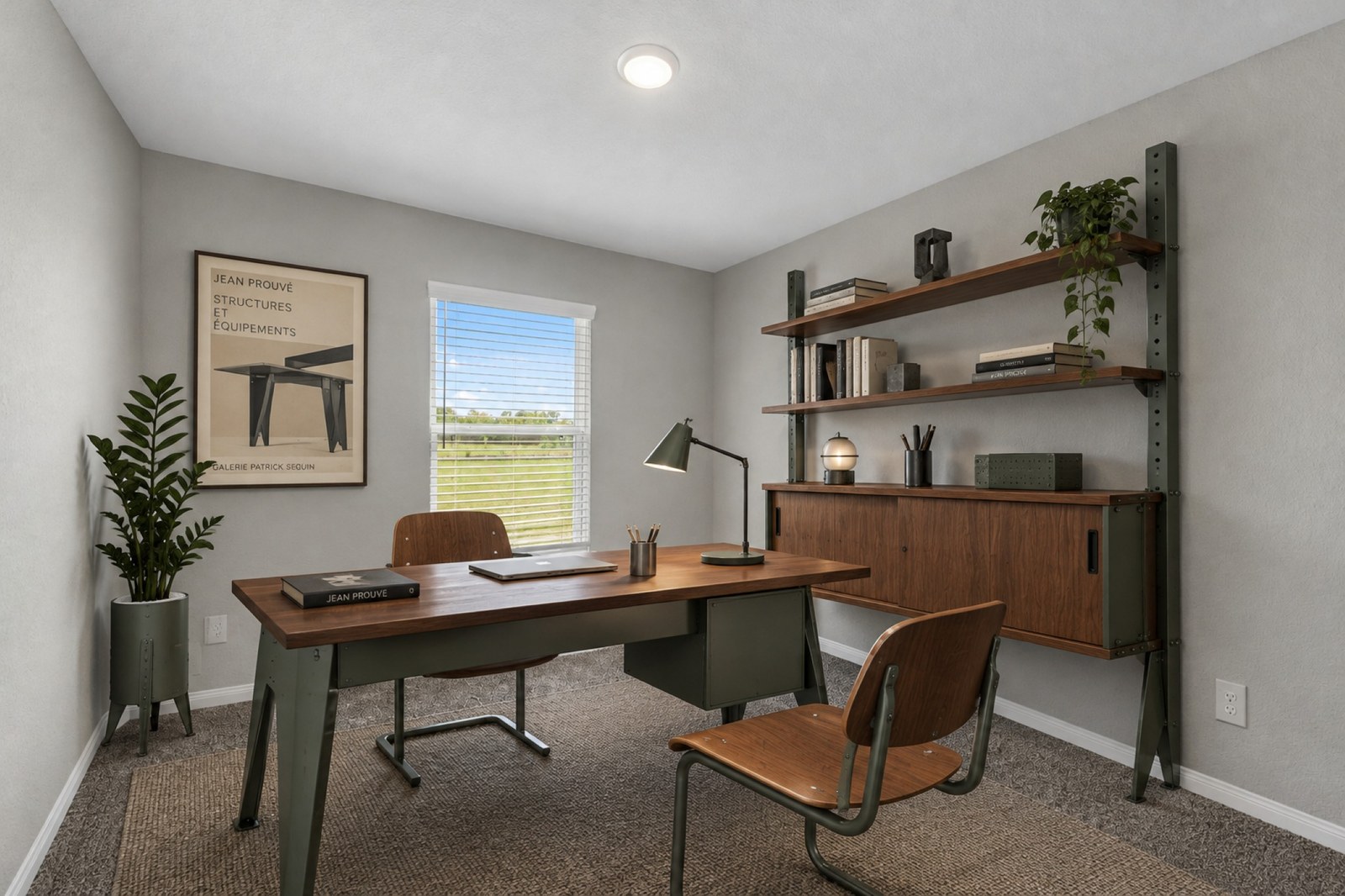 Virtually staged home office with a desk, wall shelves and a garden view